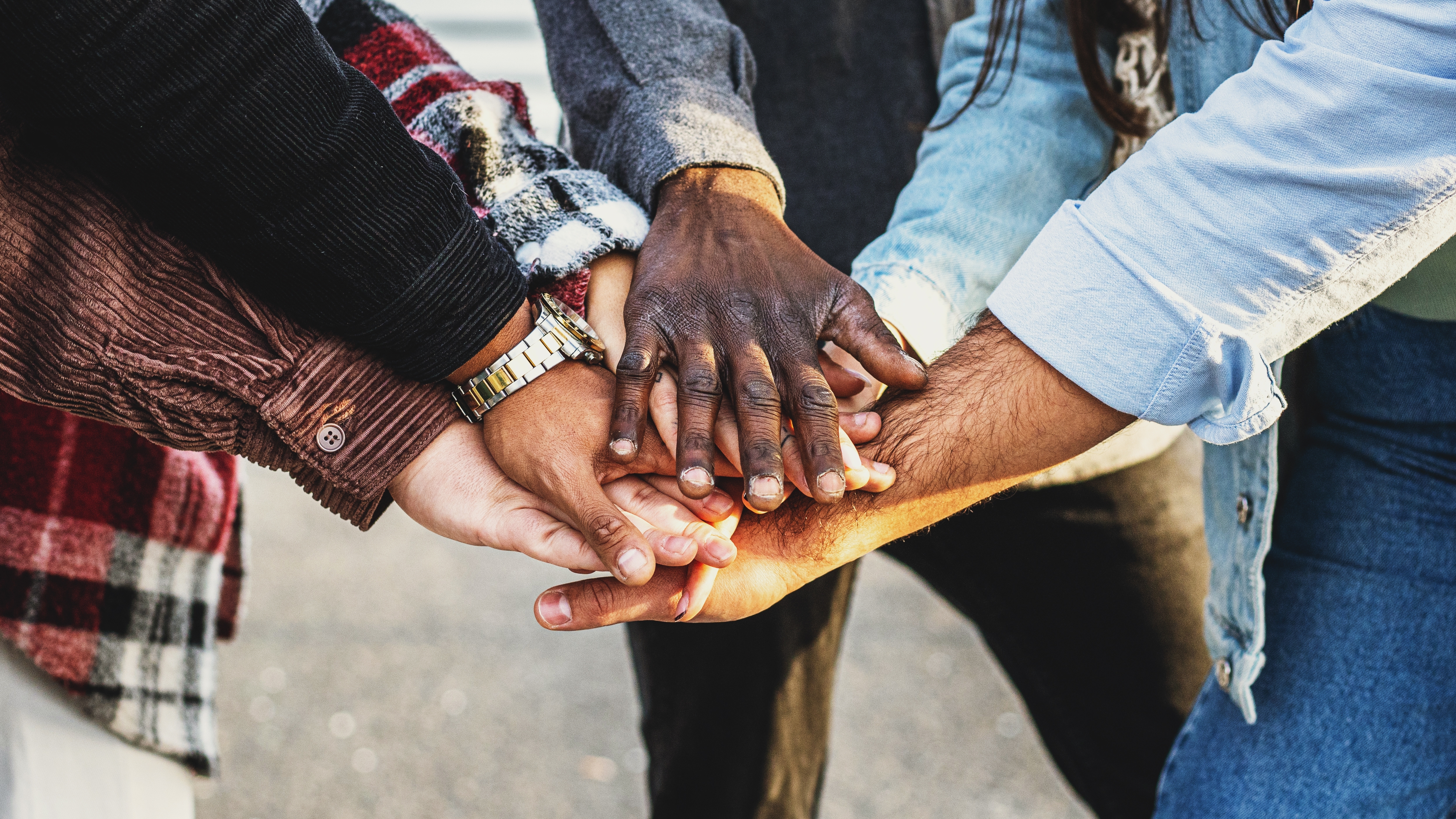 Diversity and Teamwork, poeple linking hands